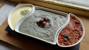 Mousse mustard, aubergine cream and Tahina, red cream with black olives